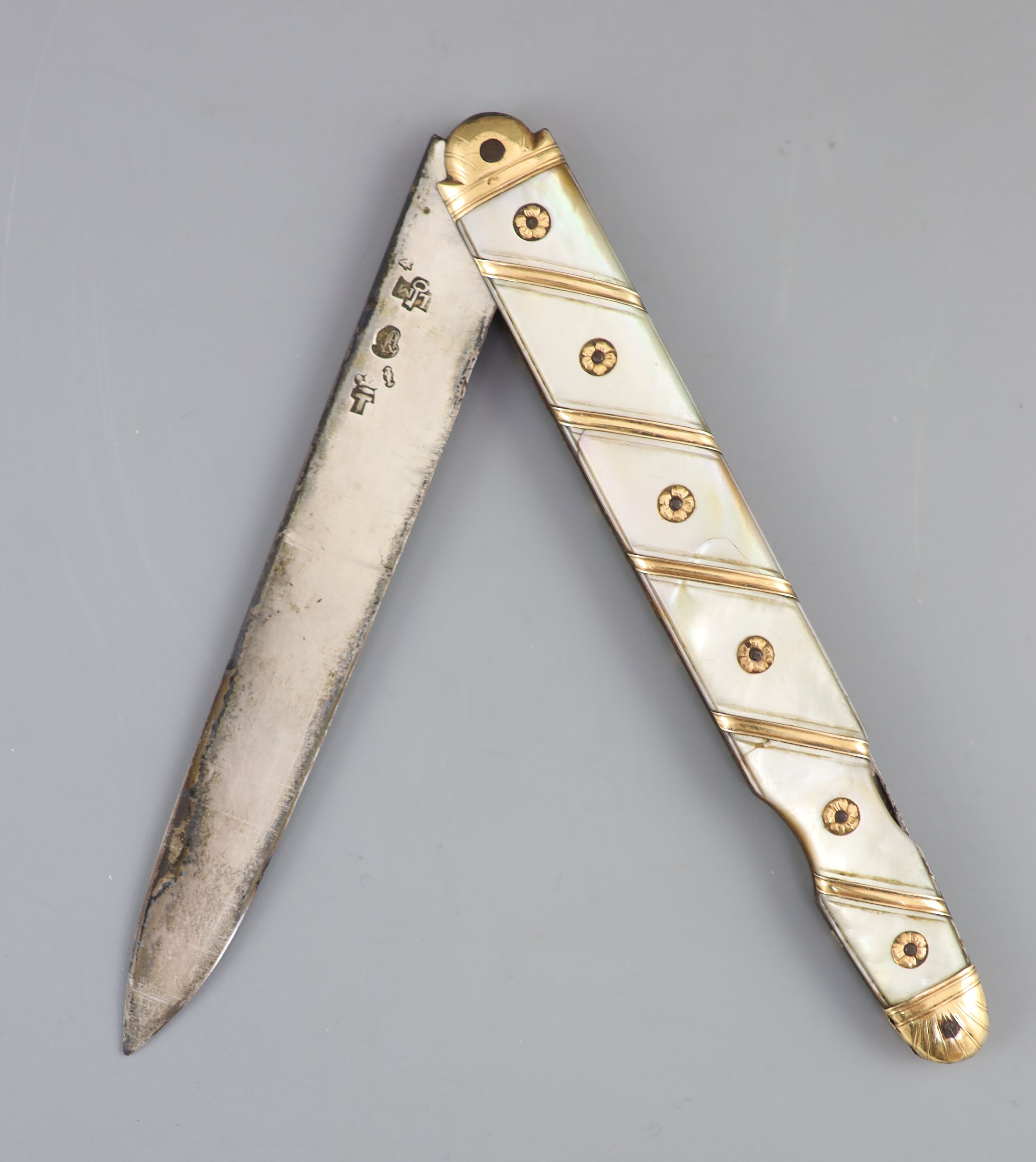 An early 19th century French? gold overlaid and mother of pearl mounted handled fruit/pocket knife,